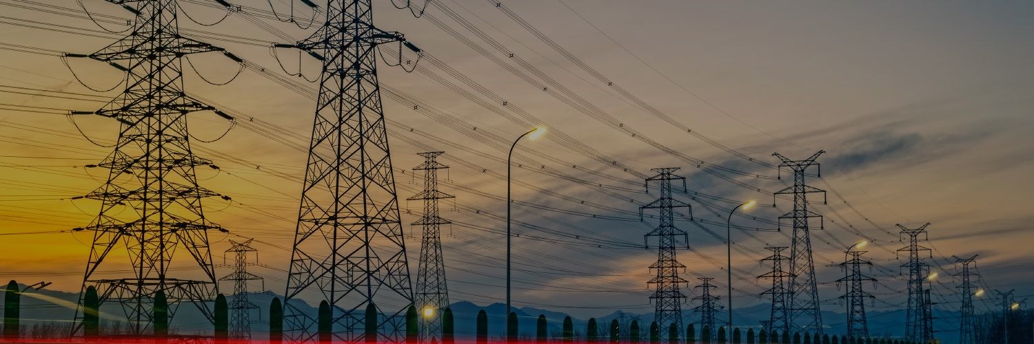 High voltage electric transmission lines at sunset