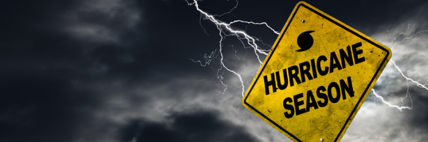 Hurricane season sign with stormy sky background