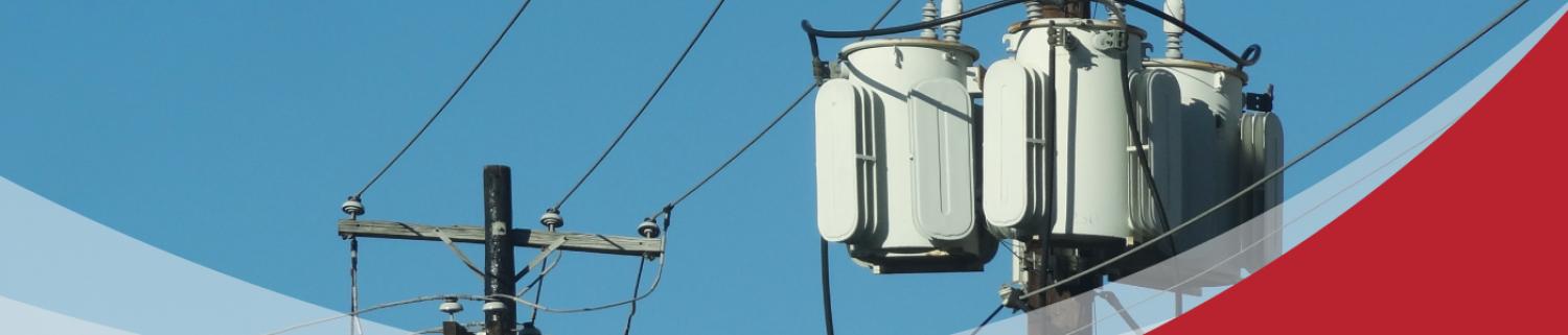 Utility poles with transformers and electric wires