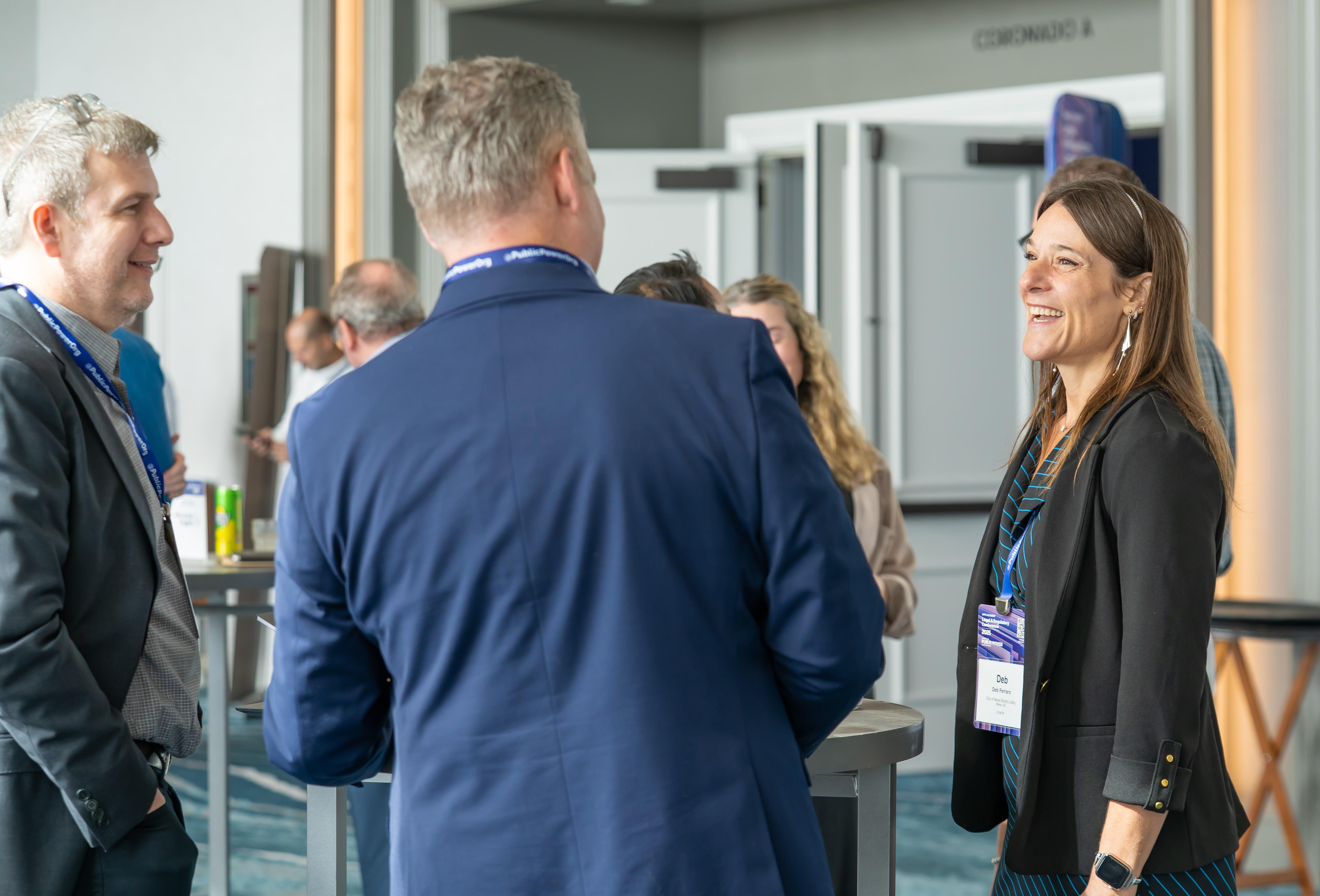People talking and laughing during conference networking