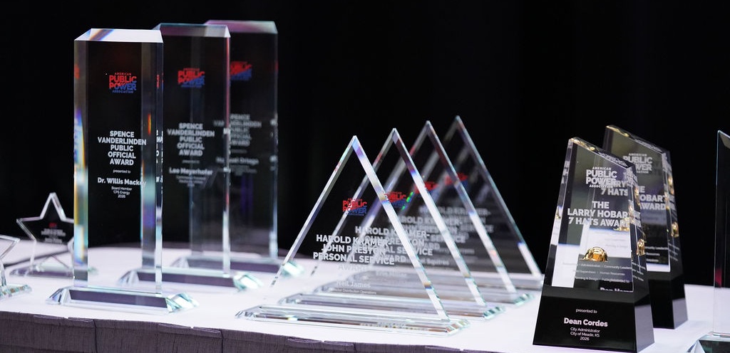 Close up of various 2026 APPA awards arranged on a table 