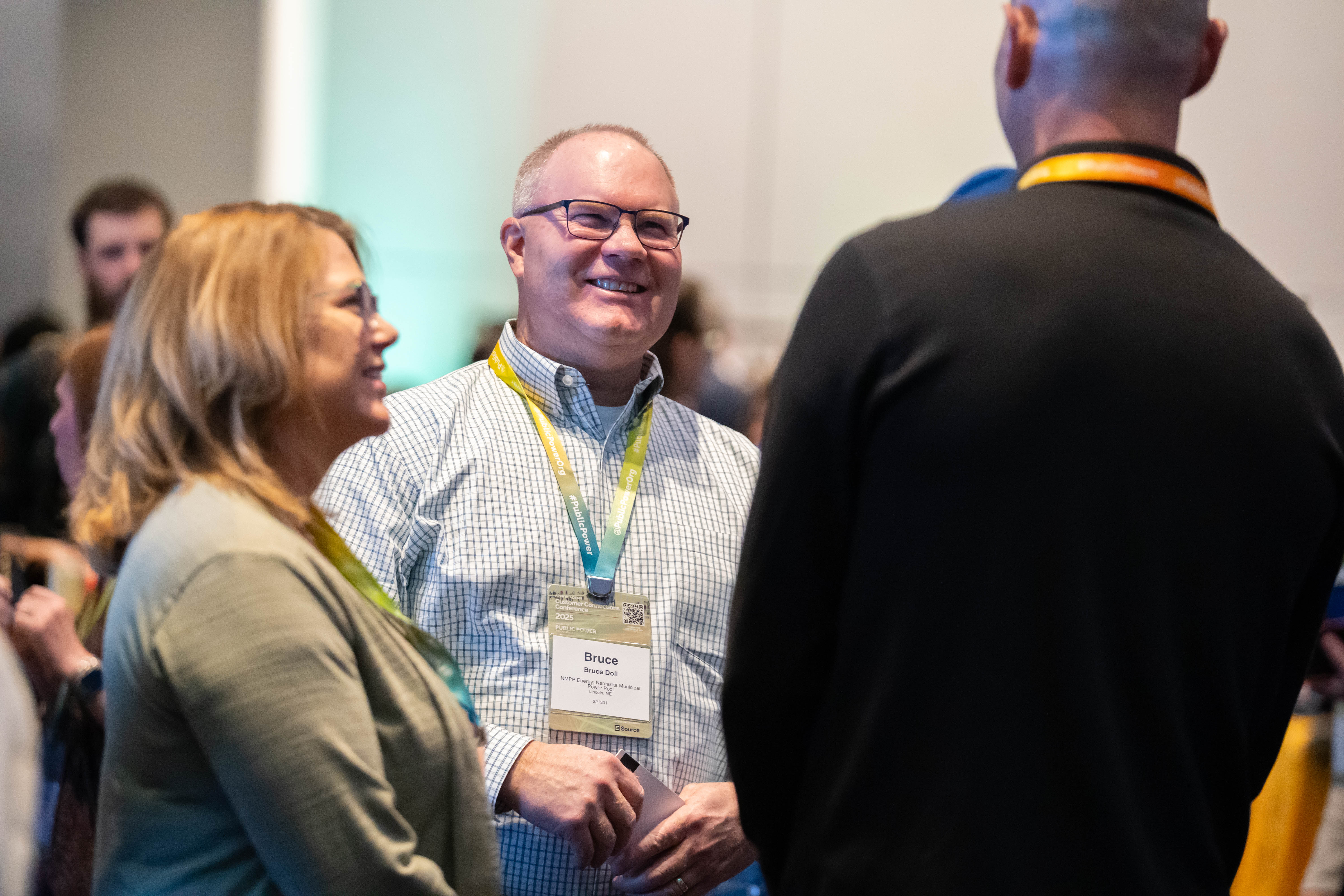 People talking and laughing during conference reception
