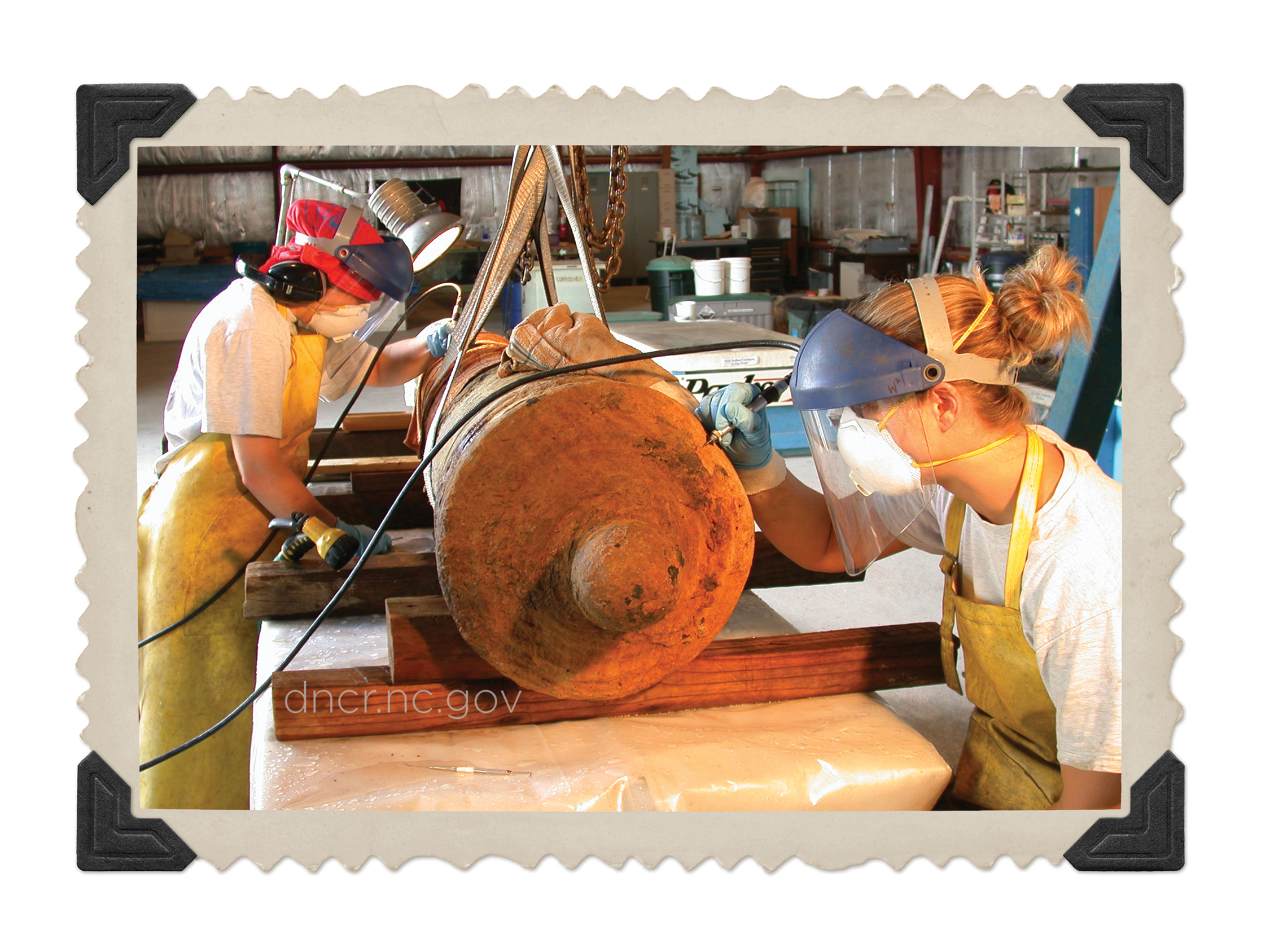 People cleaning a cannon from QAR