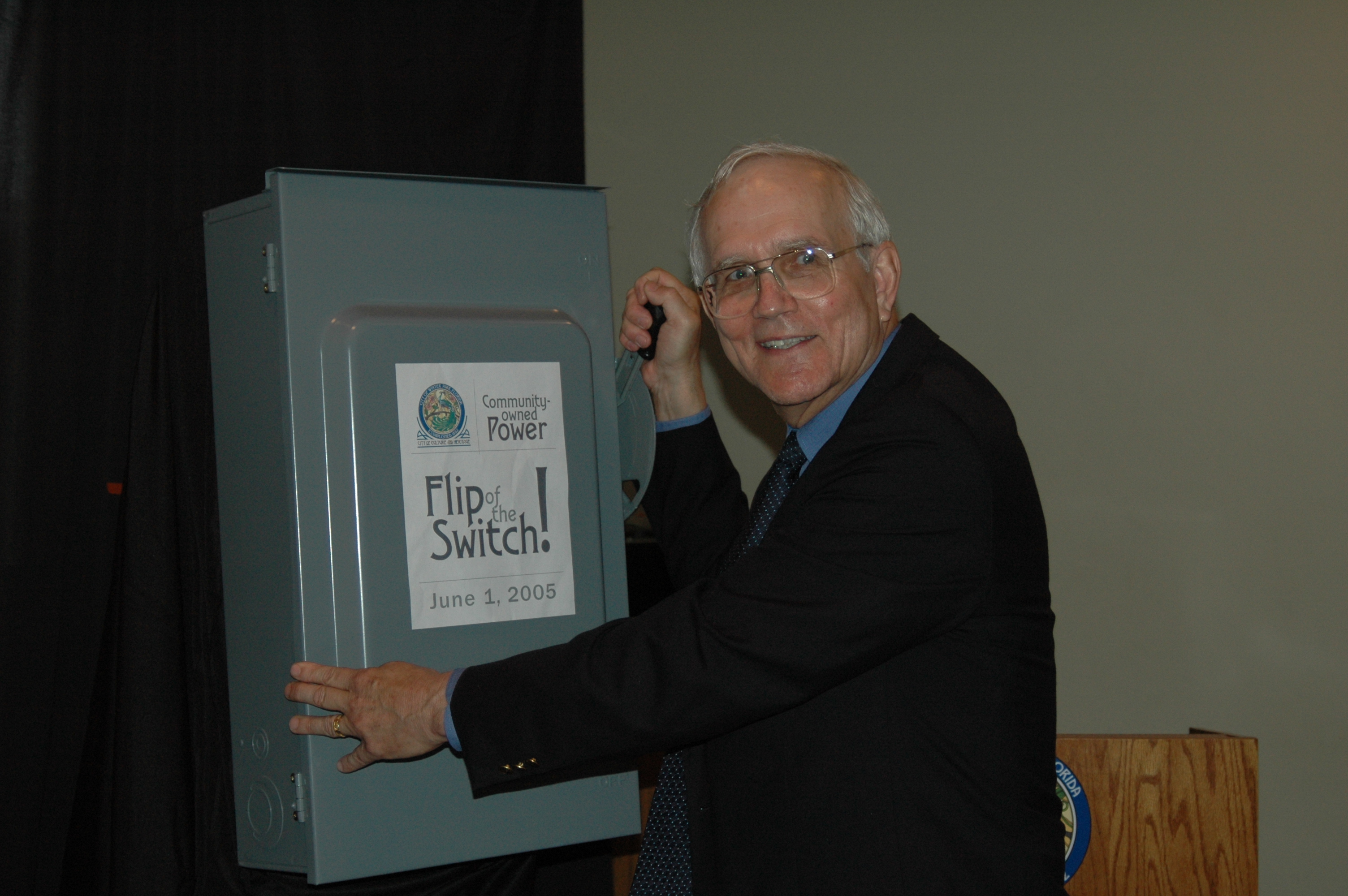 Kenneth Marchmann, mayor of Winter Park in 2005, flips the ceremonial switch to mark the start of the city-owned utility