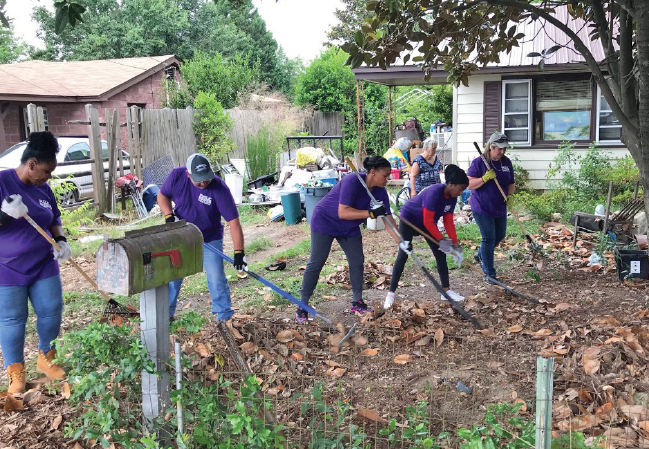 Fayetteville PWC employees in a community cleanup