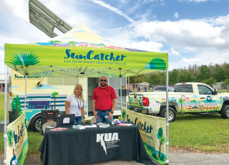 Kissimmee Utility Authority employees educate on energy with their suncatcher solar truck