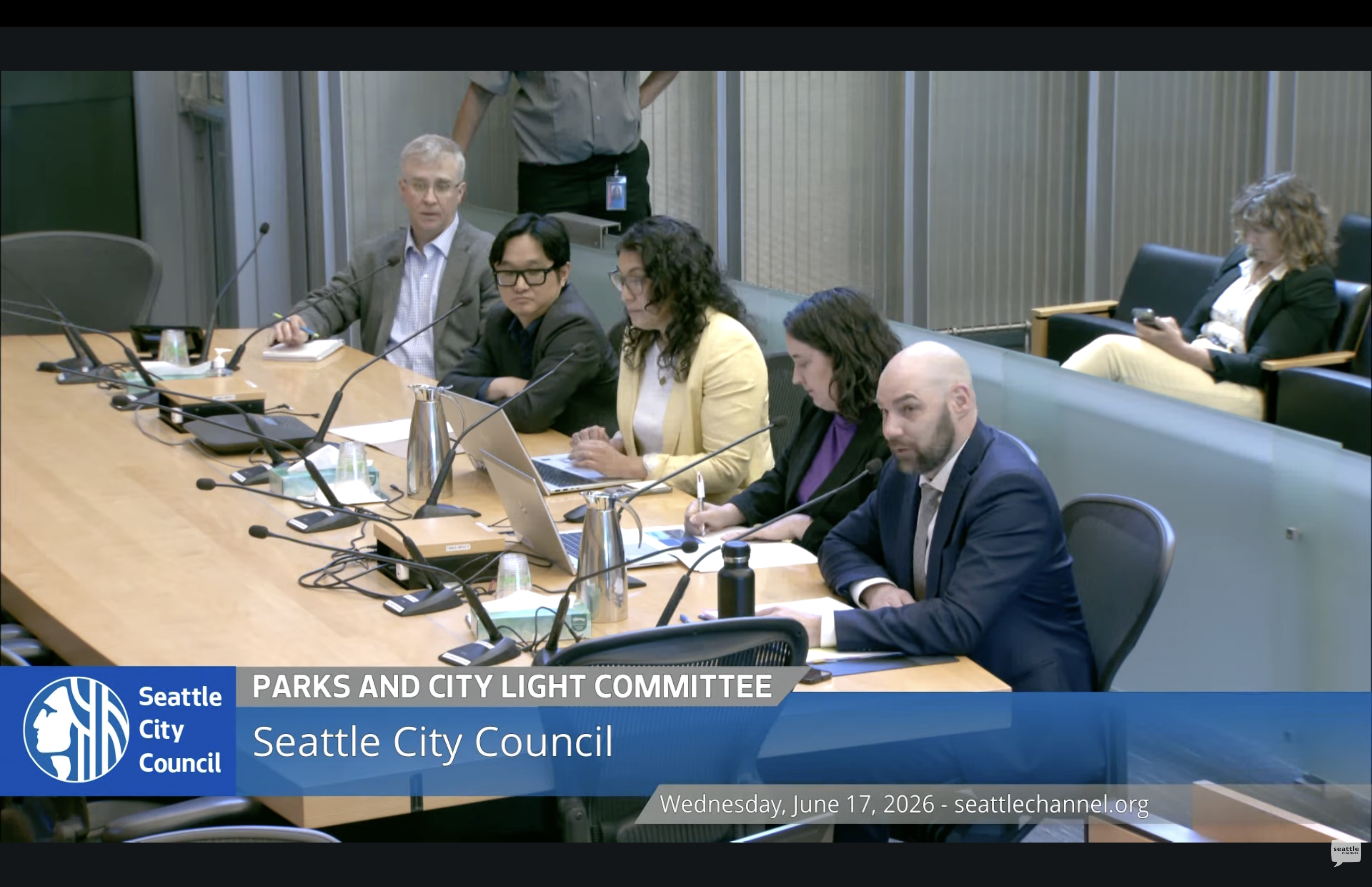 City Light staff speaking at a Seattle City Council meeting.