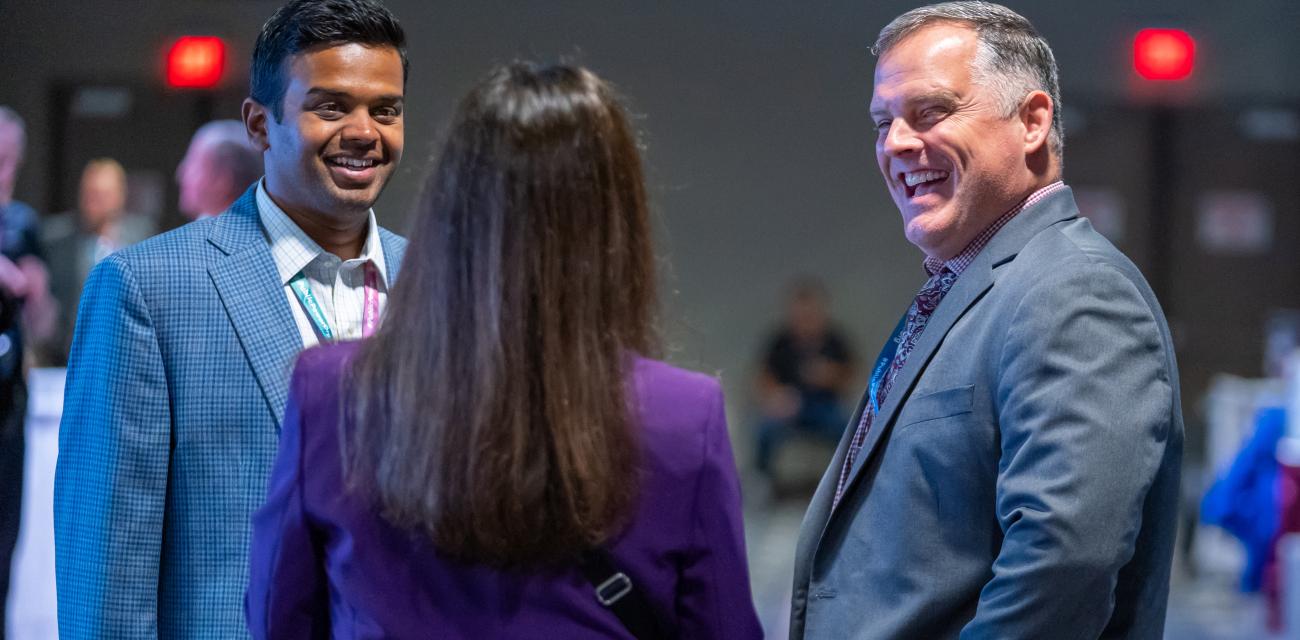 Members chatting at a conference