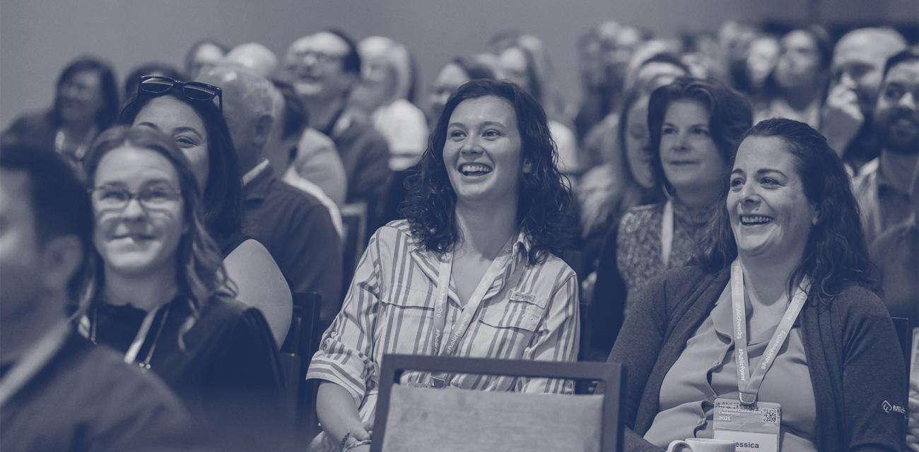 People laughing during conference session