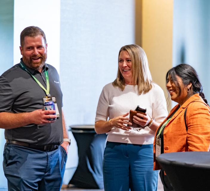 Group of members chatting at a reception