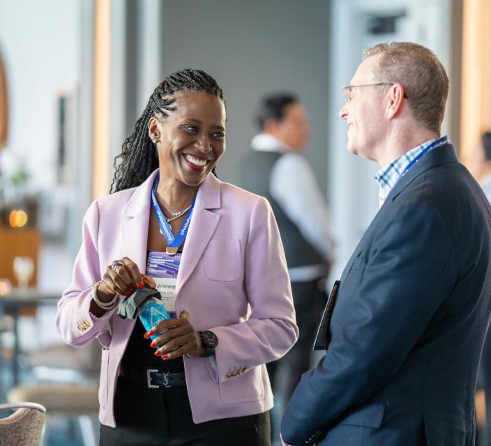 Two people talking at conference