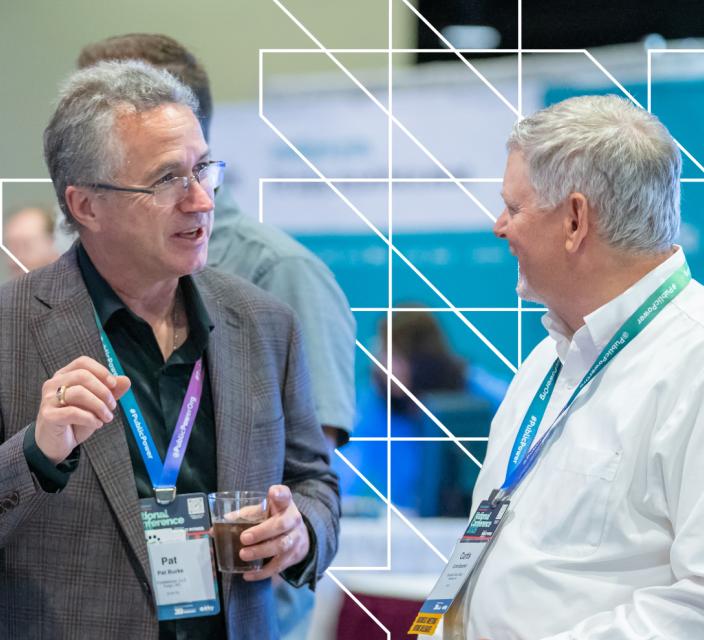 Two people talking in expo hall