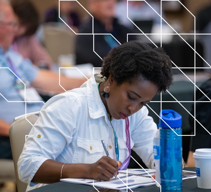 Person taking notes during session