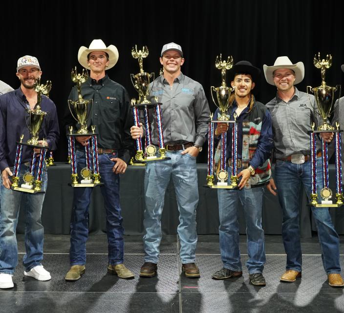 Lineworkers Rodeo winners posing with their trophies
