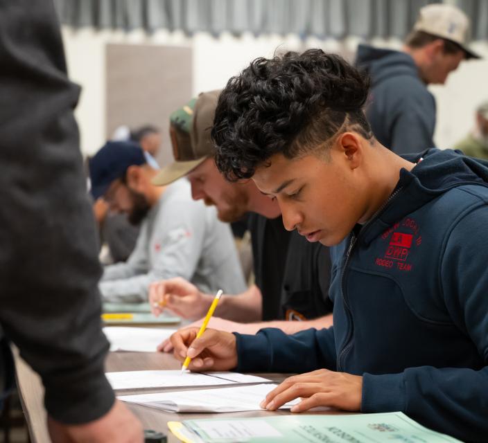 Apprentice lineworkers complete a test