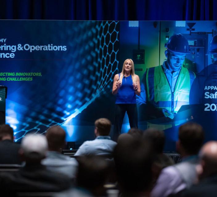 Person speaking at a conference session