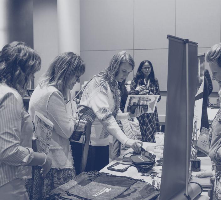 People engaging with sponsor booths