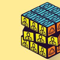 Puzzle cube with icons related to utility workforce - hard hat, briefcase, and person in suit