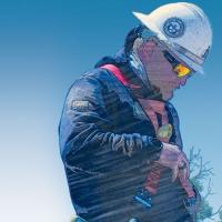 Utility worker using a safety harness