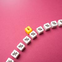 percent symbols on a pink background