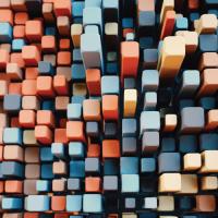 Aerial view of tightly packed colorful square pegs of varying heights