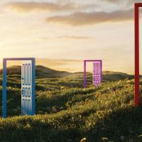 Colorful doorframes in a hilly field