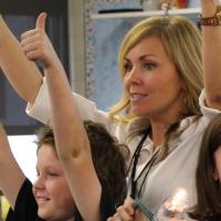 NEF energy education presenter and students in classroom