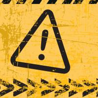warning symbol on yellow background