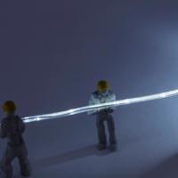 figurines of crew with a fiber cable
