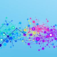 Abstract image of multicolored dots against a blue background