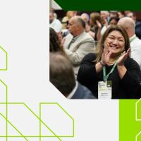 member clapping at conference
