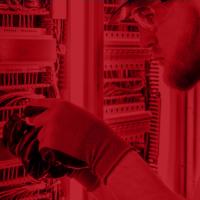Image of employee installing network sensors.