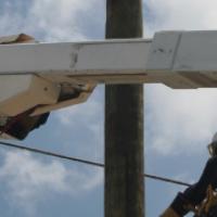 Linemen in bucket trucks