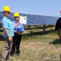 Utility communications team at a solar array