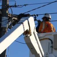 Lineworker in a bucket truck workingon a pole mounted transformer