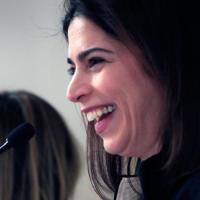 woman at microphone during legislative rally