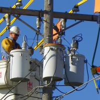 Kerrville Public Utility Board lineworkers in bucket trucks