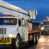 bucket trucks at night