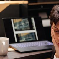 Financial investigators reviewing the aftermath of a cyberattack.