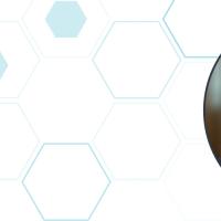 javier fernandez headshot with blue hex pattern