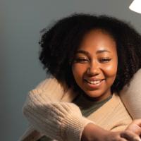 woman using a light and electronic devices at home