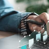 Accountant using data analytics for cost forecasting