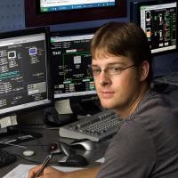 Worker at computer controls at Nearman plant