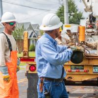 Crew with Greenville Utilities unloading a truck of supplies