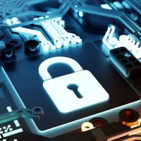 Image of a padlock within a circuit board representing cybersecurity