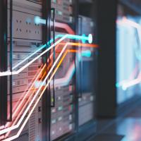 A bank of servers with colorful lines of light on top