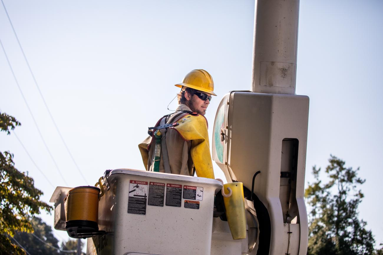 Lineworker Caleb Brickhouse in a bucket truck