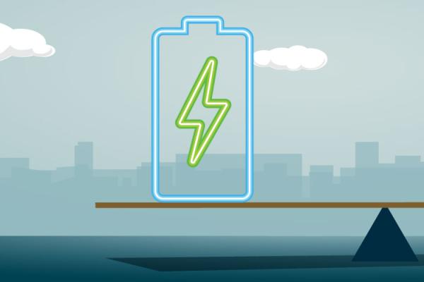 Battery and person on opposite ends of a scale in front of a city skyline