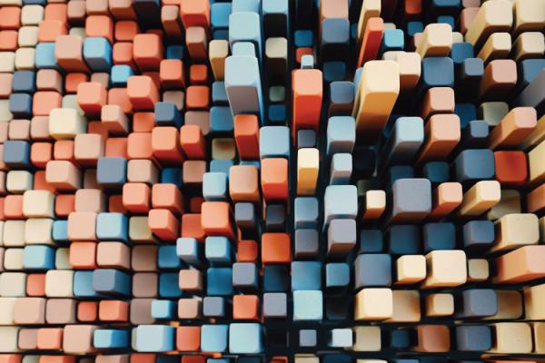 Aerial view of tightly packed colorful square pegs of varying heights