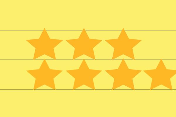 Yellow lined paper with gold star stickers
